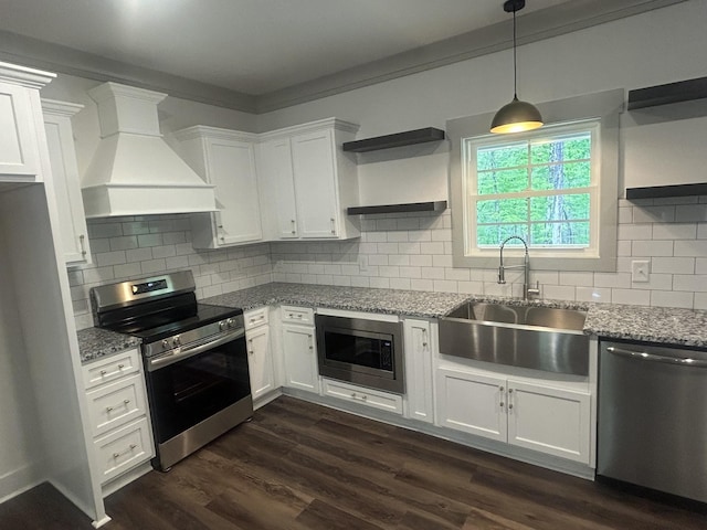 kitchen with open shelves, a sink, stainless steel appliances, white cabinetry, and custom range hood