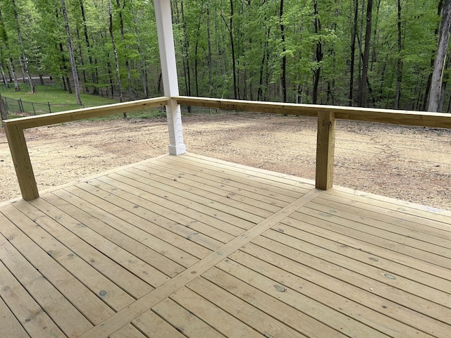 wooden deck featuring a wooded view