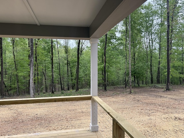 deck featuring a view of trees