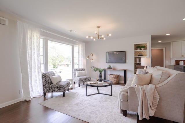 living room featuring recessed lighting, dark wood-style floors, visible vents, baseboards, and a notable chandelier