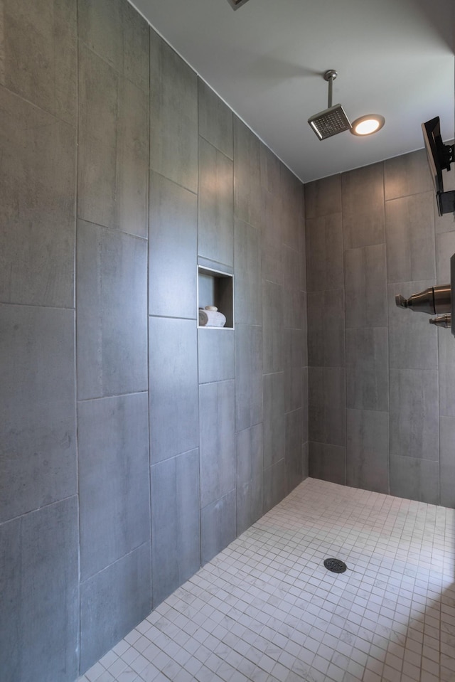 bathroom with tiled shower