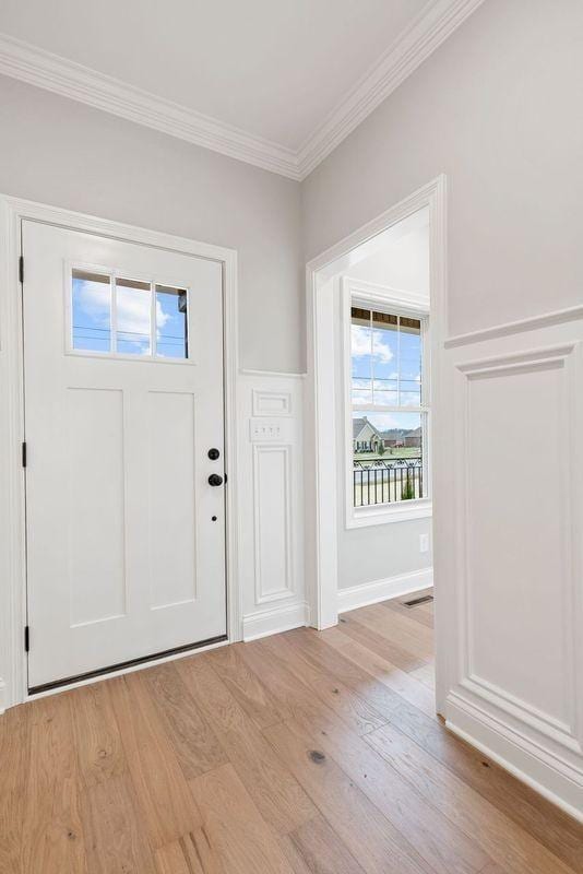 1111 Joe Martin Ln, Lebanon, TN 37087 - entryway featuring light wood-type flooring and crown molding