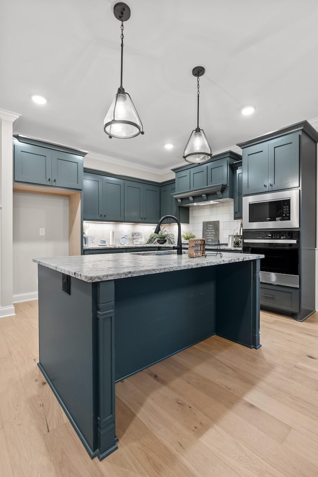 1111 Joe Martin Ln, Lebanon, TN 37087 - kitchen featuring light stone counters, tasteful backsplash, hanging light fixtures, a sink, and stainless steel appliances
