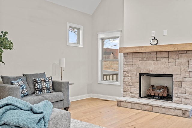 1111 Joe Martin Ln, Lebanon, TN 37087 - living room with high vaulted ceiling, wood finished floors, a fireplace, baseboards, and visible vents
