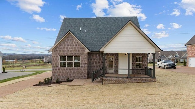 1111 Joe Martin Ln, Lebanon, TN 37087 - view of front of home with a shingled roof, covered porch, and brick siding