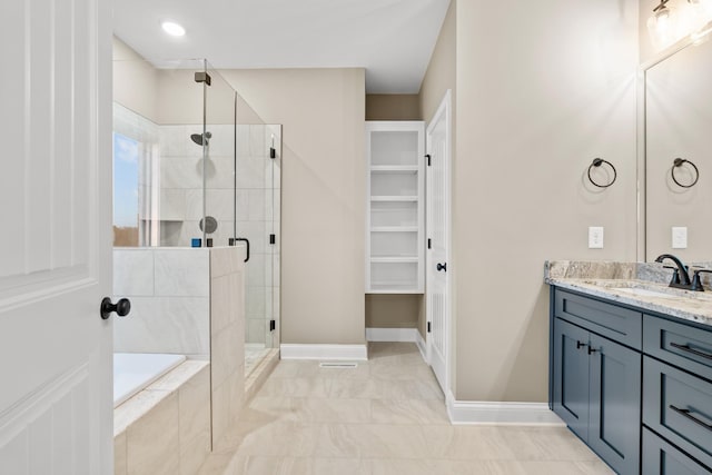1111 Joe Martin Ln, Lebanon, TN 37087 - bathroom featuring a stall shower, a spacious closet, vanity, a relaxing tiled tub, and baseboards