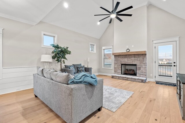 1111 Joe Martin Ln, Lebanon, TN 37087 - living area with recessed lighting, a stone fireplace, a ceiling fan, light wood-type flooring, and high vaulted ceiling