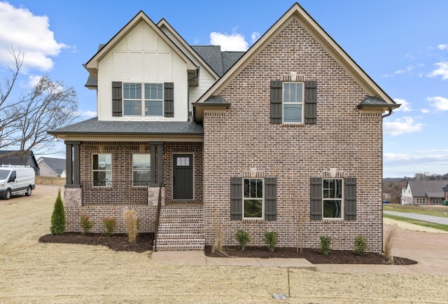 1111 Joe Martin Ln, Lebanon, TN 37087 - craftsman inspired home featuring brick siding, roof with shingles, board and batten siding, and covered porch