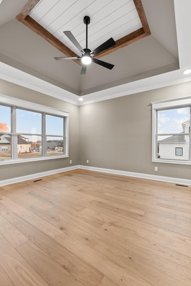 1111 Joe Martin Ln, Lebanon, TN 37087 - spare room with visible vents, a ceiling fan, a tray ceiling, and light wood-style floors