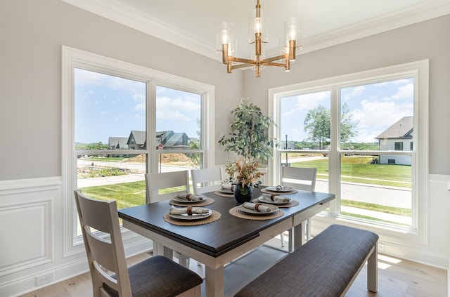 1117 Joe Martin Ln, Lebanon, TN 37087 - dining space with crown molding, a healthy amount of sunlight, a chandelier, and light wood-type flooring