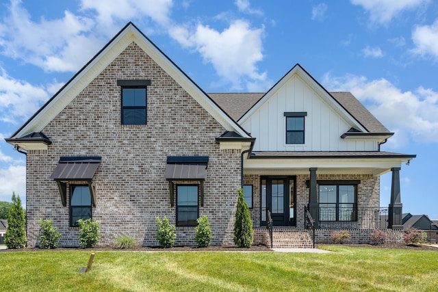 1117 Joe Martin Ln, Lebanon, TN 37087 - view of front of home featuring board and batten siding, covered porch, brick siding, and a front yard