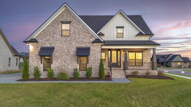 1117 Joe Martin Ln, Lebanon, TN 37087 - view of front of home with board and batten siding, covered porch, and brick siding