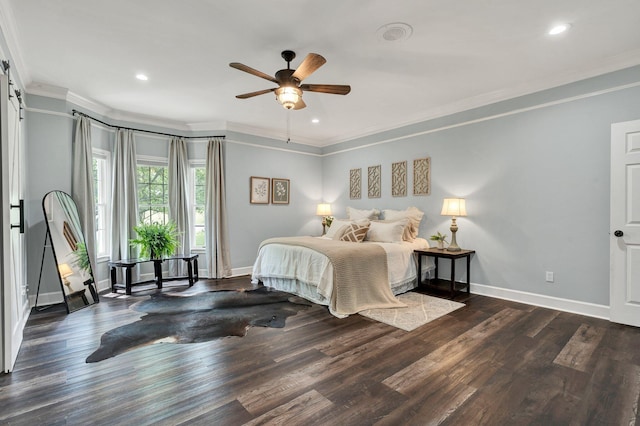 bedroom featuring baseboards, ornamental molding, wood finished floors, and recessed lighting