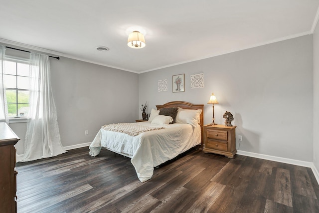 bedroom featuring crown molding, visible vents, and dark wood-style flooring