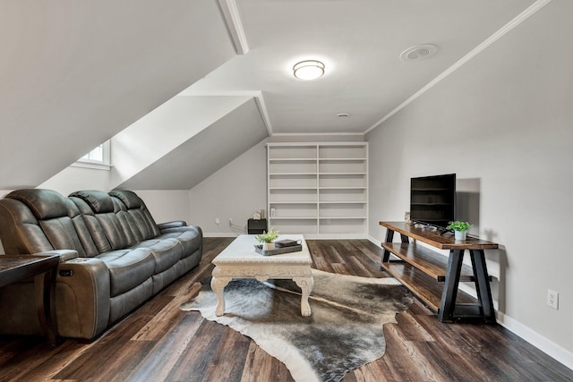 living area with baseboards, vaulted ceiling, wood finished floors, and built in features