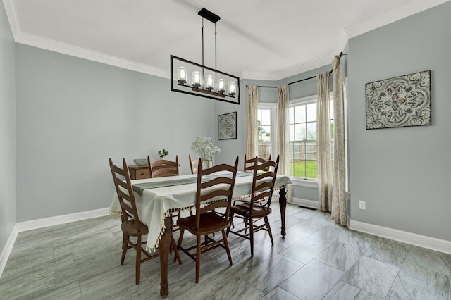 dining space with baseboards, an inviting chandelier, and ornamental molding