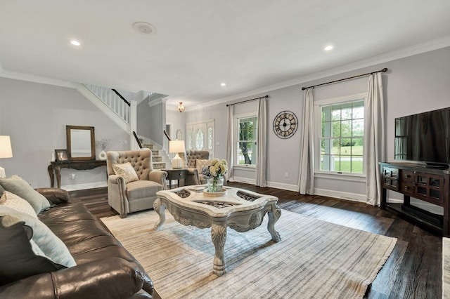 living area featuring stairway, baseboards, crown molding, and wood finished floors