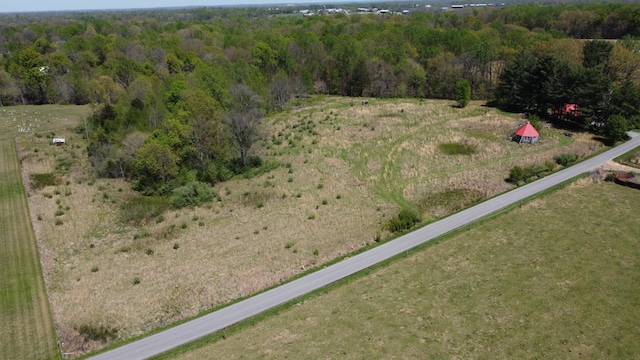 birds eye view of property with a wooded view