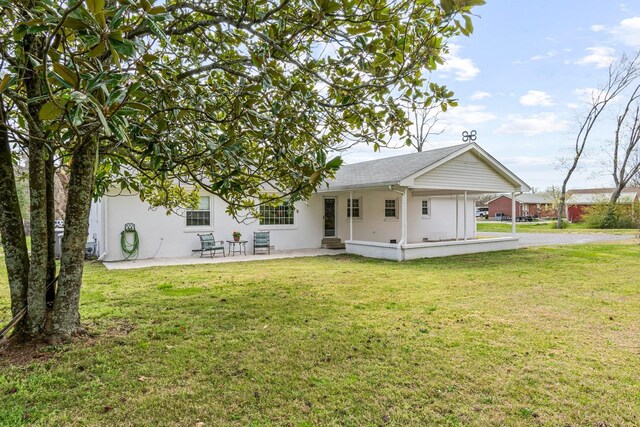 8803 Horton Hwy, College Grove, TN 37046 - back of house featuring a lawn, a patio, and stucco siding