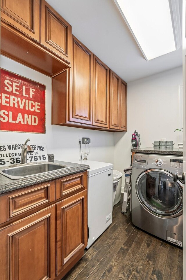 8803 Horton Hwy, College Grove, TN 37046 - washroom with washing machine and dryer, dark wood-style flooring, a sink, and cabinet space