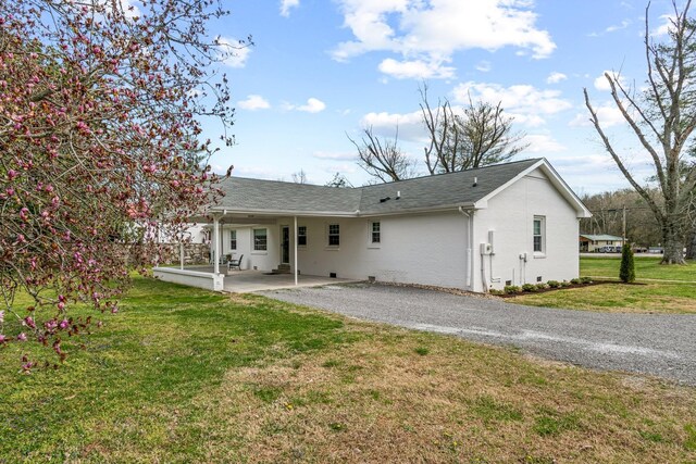 8803 Horton Hwy, College Grove, TN 37046 - rear view of house featuring driveway, a yard, a patio, and a shingled roof