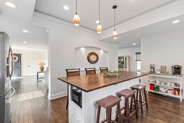 8803 Horton Hwy, College Grove, TN 37046 - kitchen featuring wood counters, dark wood-type flooring, a kitchen breakfast bar, and stainless steel fridge with ice dispenser