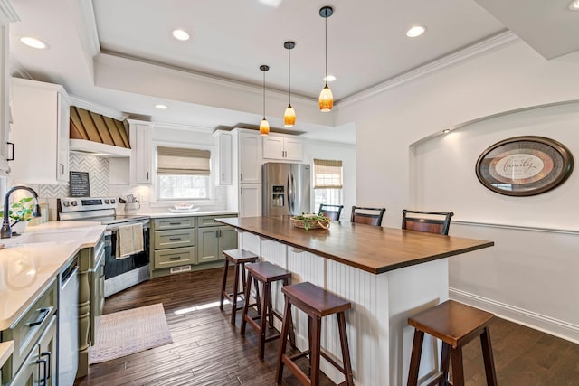 8803 Horton Hwy, College Grove, TN 37046 - kitchen with a kitchen breakfast bar, a sink, wooden counters, and appliances with stainless steel finishes