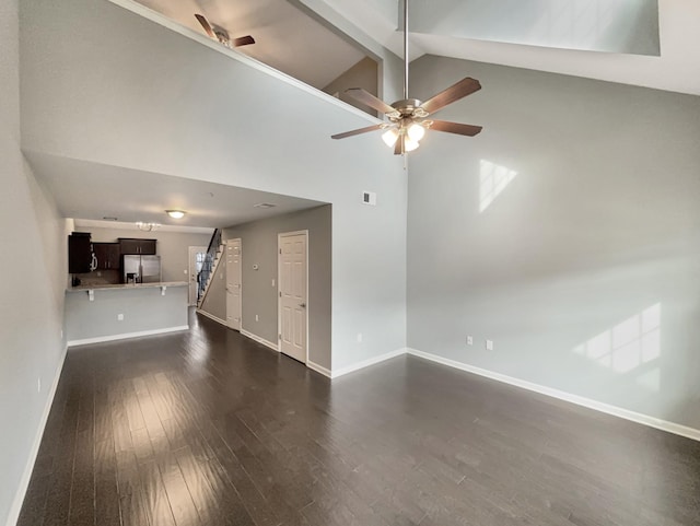unfurnished living room with dark wood-style flooring, baseboards, beamed ceiling, a ceiling fan, and high vaulted ceiling