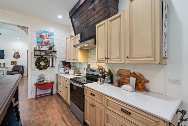 703 Gaither Hinson Rd, Waynesboro, TN 38485 - kitchen featuring stainless steel range with electric stovetop, light countertops, dark wood-style floors, under cabinet range hood, and cream cabinetry