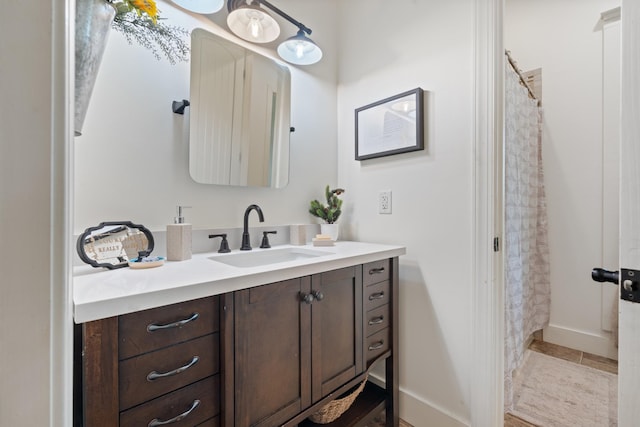 703 Gaither Hinson Rd, Waynesboro, TN 38485 - full bathroom with vanity, baseboards, and a shower with shower curtain