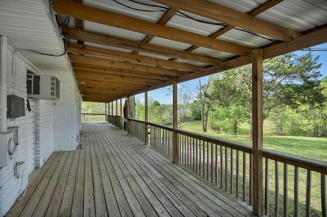 wooden deck featuring a lawn