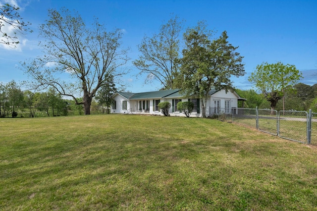 view of yard featuring fence and a gate