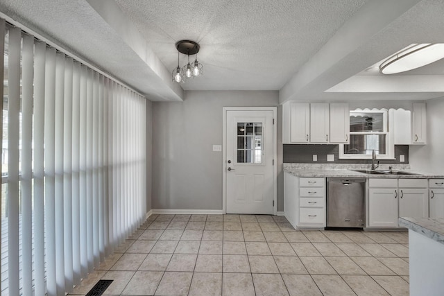 kitchen with white cabinets, plenty of natural light, dishwasher, and a sink