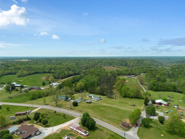 bird's eye view featuring a wooded view