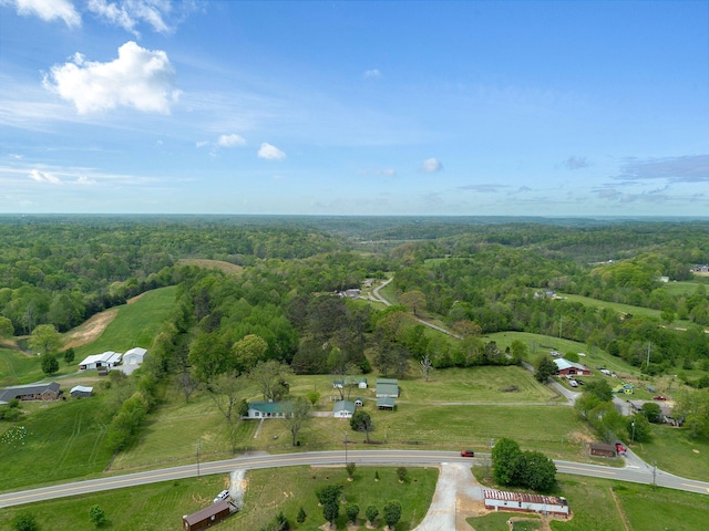 bird's eye view featuring a forest view