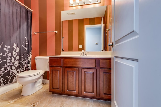 bathroom with visible vents, toilet, vanity, and a shower with curtain