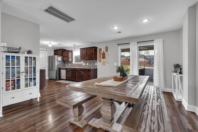 dining space with baseboards, dark wood-style flooring, visible vents, and recessed lighting