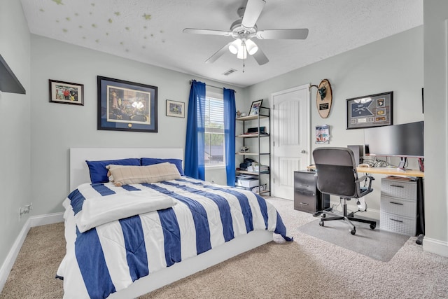 bedroom featuring ceiling fan, baseboards, visible vents, and carpet