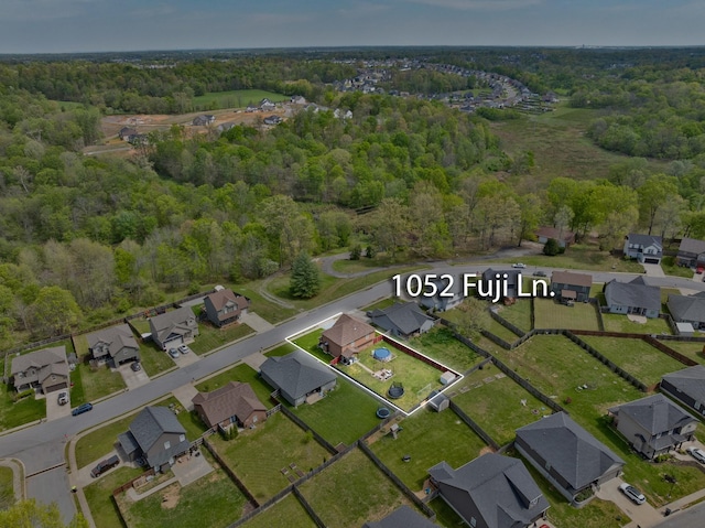 aerial view with a view of trees and a residential view
