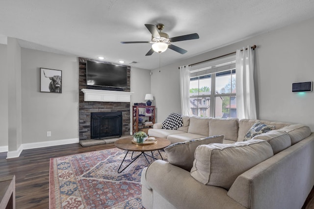 living area with recessed lighting, ceiling fan, baseboards, a fireplace, and dark wood-style flooring