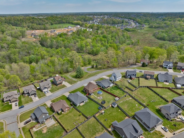 aerial view featuring a residential view and a view of trees