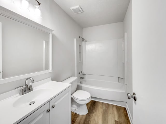 288 Donna Dr Unit F, Hendersonville, TN 37075 - bathroom featuring wood finished floors, vanity, tub / shower combination, toilet, and visible vents