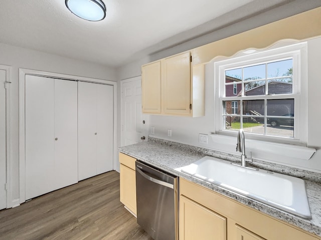 288 Donna Dr Unit F, Hendersonville, TN 37075 - kitchen featuring light wood-type flooring, cream cabinetry, stainless steel dishwasher, and a sink