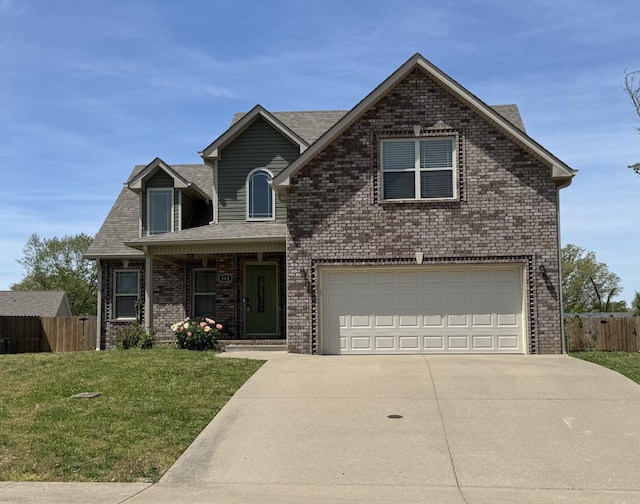 144 Sycamore Hill Dr, Clarksville, TN 37042 - view of front of house with concrete driveway, a front lawn, an attached garage, fence, and brick siding