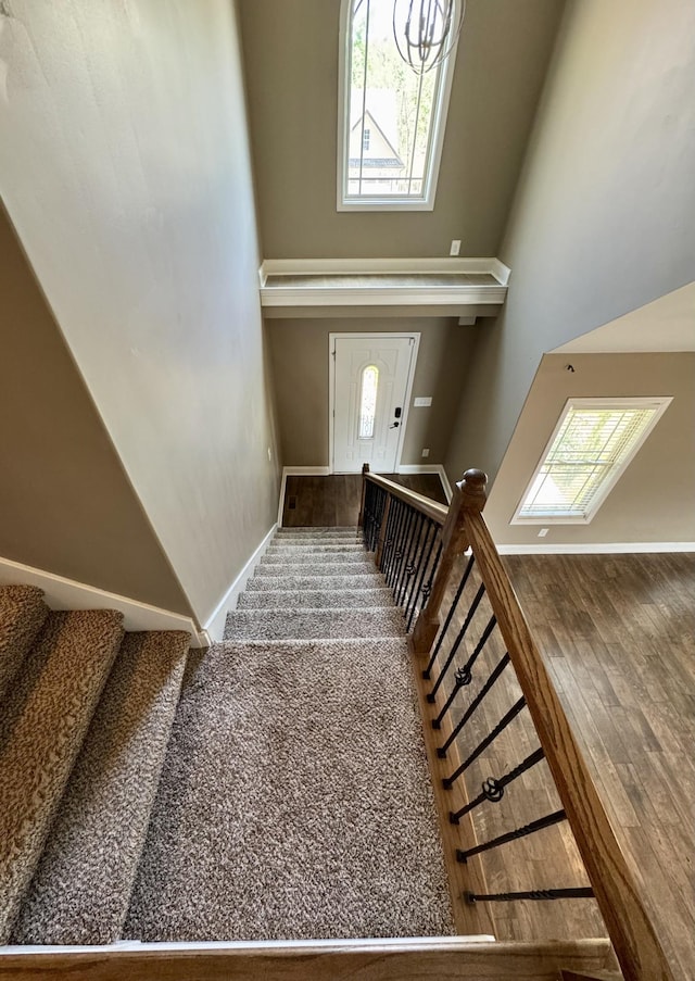 144 Sycamore Hill Dr, Clarksville, TN 37042 - staircase featuring a towering ceiling and baseboards