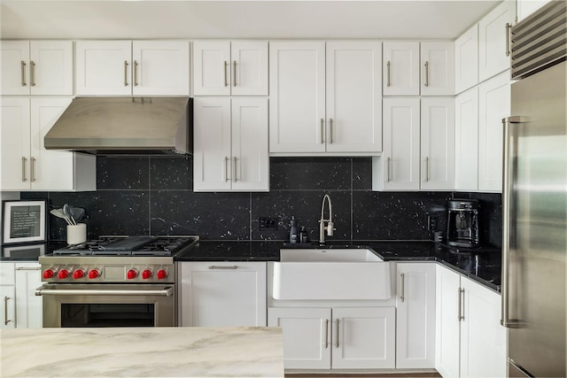 1616 W End Ave Unit 1803, Nashville, TN 37203 - kitchen featuring a sink, premium appliances, white cabinetry, and exhaust hood