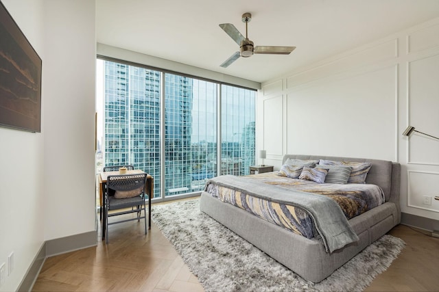 1616 W End Ave Unit 1803, Nashville, TN 37203 - bedroom featuring a ceiling fan, baseboards, and multiple windows
