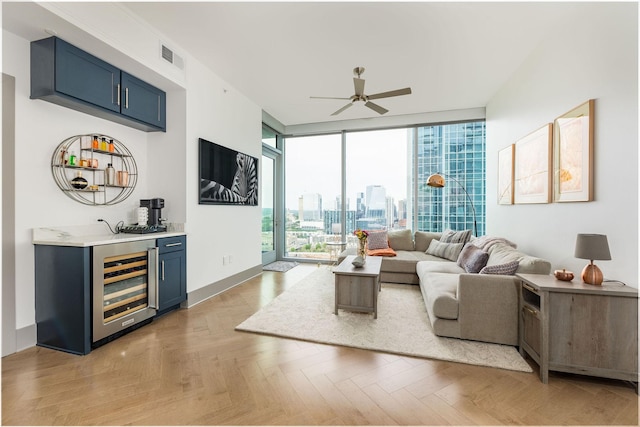 1616 W End Ave Unit 1803, Nashville, TN 37203 - living room featuring visible vents, a wall of windows, ceiling fan, indoor wet bar, and beverage cooler