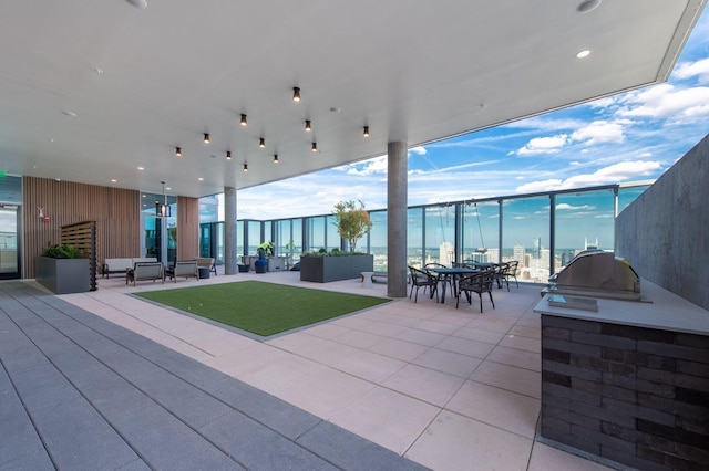 1616 W End Ave Unit 1803, Nashville, TN 37203 - view of patio / terrace featuring an outdoor kitchen and an outdoor living space