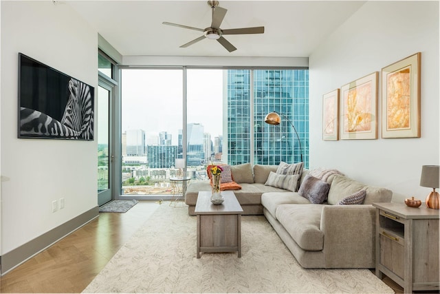 1616 W End Ave Unit 1803, Nashville, TN 37203 - living area with floor to ceiling windows, a city view, wood finished floors, and a ceiling fan